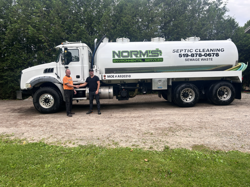 Dom with John Bissell during the Norm’s Environmental Service transition